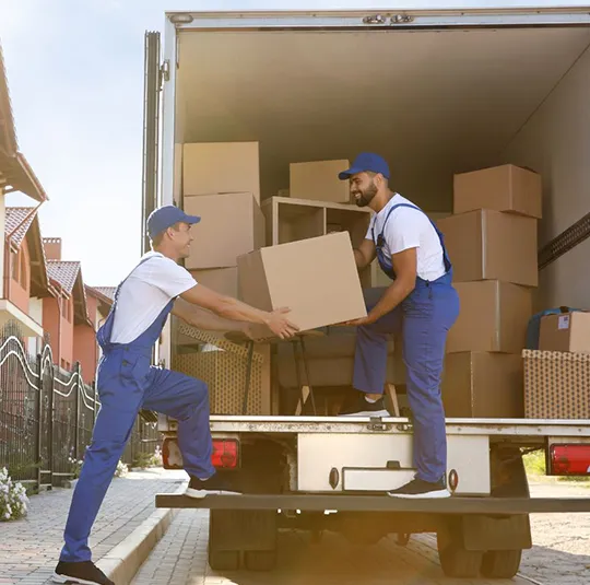 Two movers unloading boxes from a truck, with a text box describing professional interstate moving services.