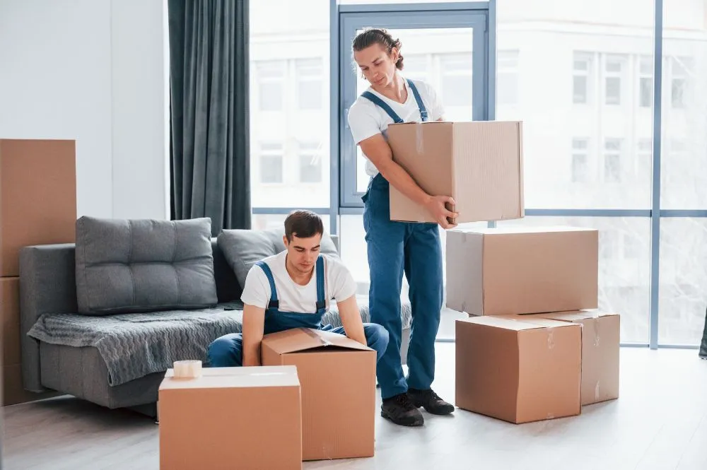 Professional movers efficiently unpacking and organizing belongings, ensuring a stress-free relocation experience in Oklahoma City, OK.
