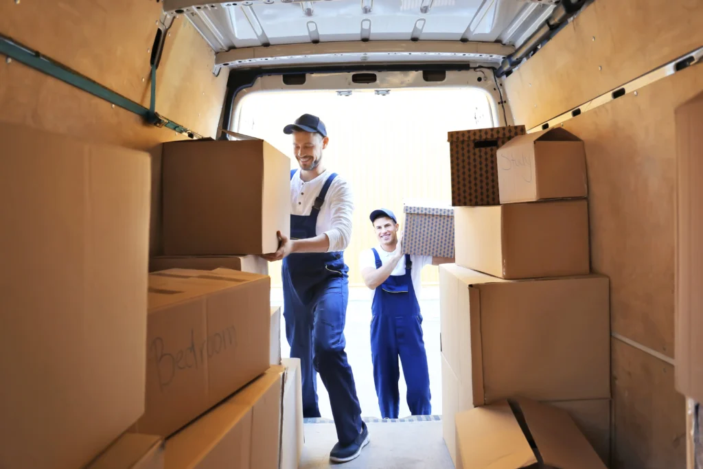 Movers carry boxes into a truck in Midwest City, OK.